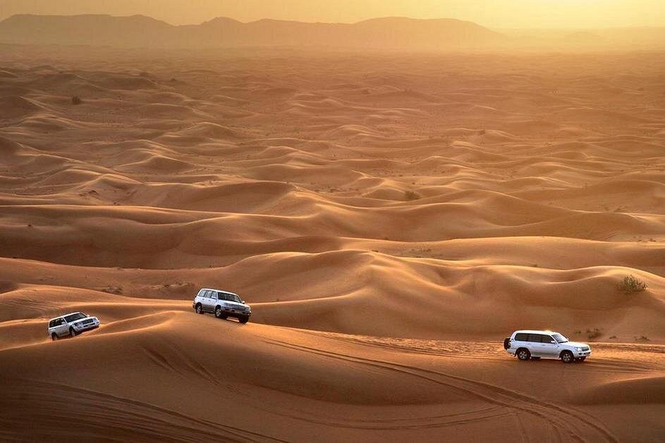 Ultimate Dubai Desert Safari: Dune Bashing, Sandboarding, Camel Ride & BBQ